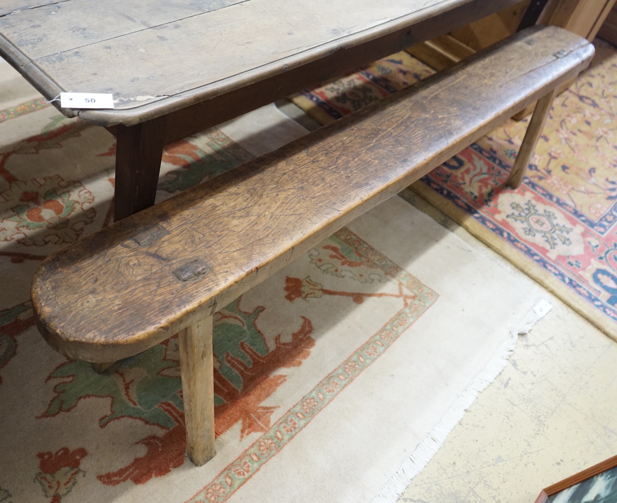 A pair of 19th century provincial elm and beech bench seats, length 199cm, depth 23cm, height 48cm